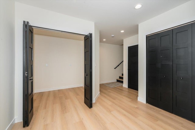 3733 London Rd Unit 15, Duluth, MN 55804 - unfurnished bedroom featuring light wood-style flooring, recessed lighting, and a closet