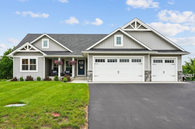 1623 Otter Way, New Richmond, WI 54017 - craftsman-style house featuring roof with shingles, asphalt driveway, a garage, a porch, and a front lawn