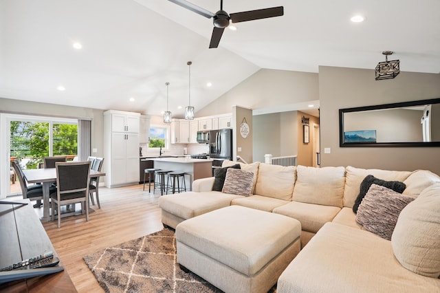 1623 Otter Way, New Richmond, WI 54017 - living area featuring light wood-style floors, recessed lighting, ceiling fan, and high vaulted ceiling