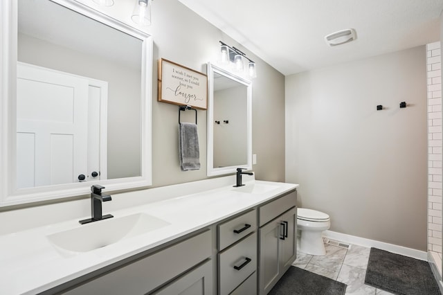 1623 Otter Way, New Richmond, WI 54017 - bathroom featuring double vanity and marble finish floors