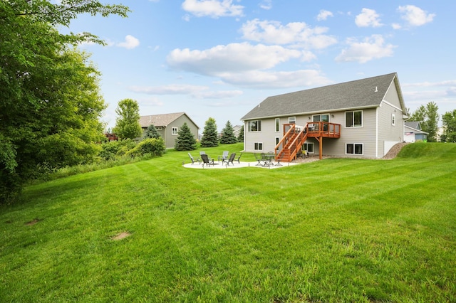 1623 Otter Way, New Richmond, WI 54017 - back of house with a fire pit, a deck, stairs, a patio, and a lawn