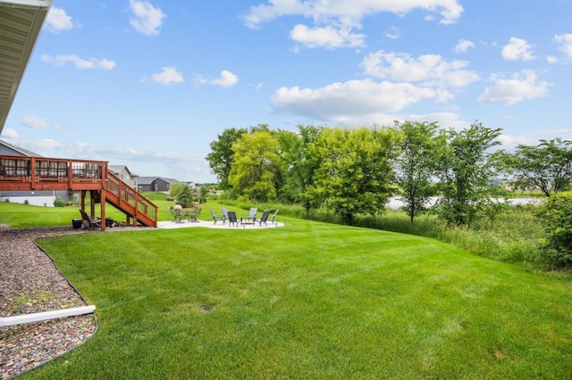 1623 Otter Way, New Richmond, WI 54017 - view of green lawn featuring a patio area, stairs, and a deck