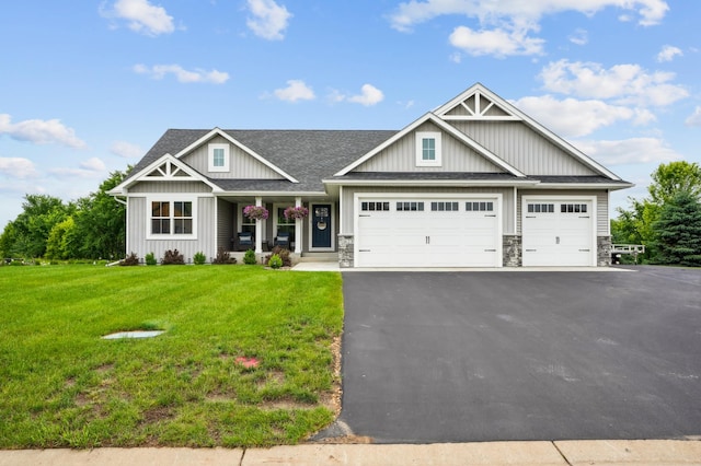 1623 Otter Way, New Richmond, WI 54017 - craftsman inspired home with an attached garage, asphalt driveway, a front lawn, and board and batten siding