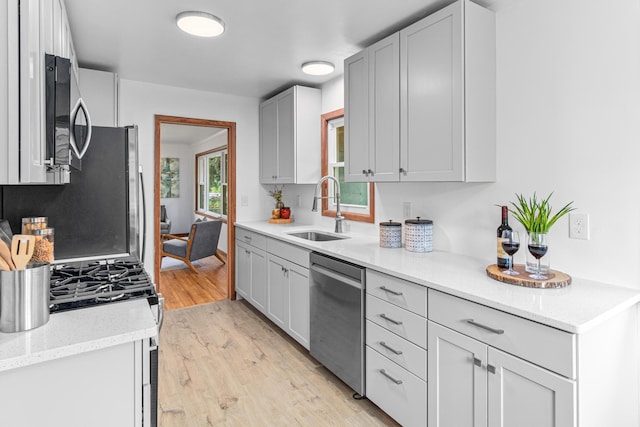 2196 7th St W, Saint Paul, MN 55116 - kitchen featuring appliances with stainless steel finishes and light wood-type flooring