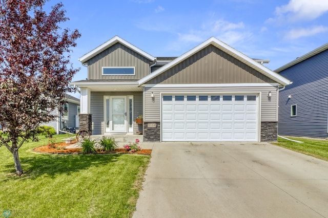 1334 6th St NW, Fargo, ND 58078 - craftsman inspired home with stone siding, a garage, board and batten siding, a front yard, and driveway
