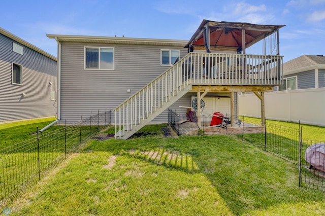 1334 6th St NW, Fargo, ND 58078 - back of property with a fenced backyard, stairs, and a wooden deck