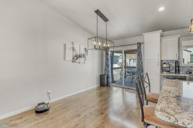 1334 6th St NW, Fargo, ND 58078 - dining space featuring light wood-style floors, a chandelier, and recessed lighting