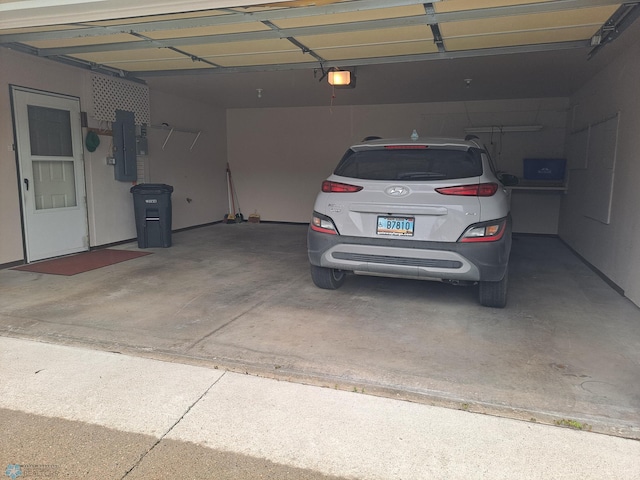 5409 University Dr S Unit D, Fargo, ND 58104 - garage with electric panel and a garage door opener