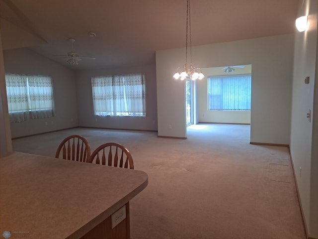 5409 University Dr S Unit D, Fargo, ND 58104 - dining area with ceiling fan, light carpet, vaulted ceiling, and a chandelier