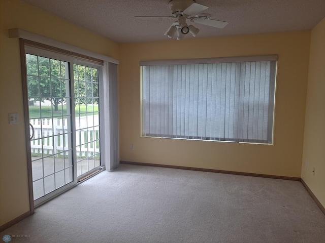 5409 University Dr S Unit D, Fargo, ND 58104 - carpeted spare room featuring ceiling fan and a textured ceiling