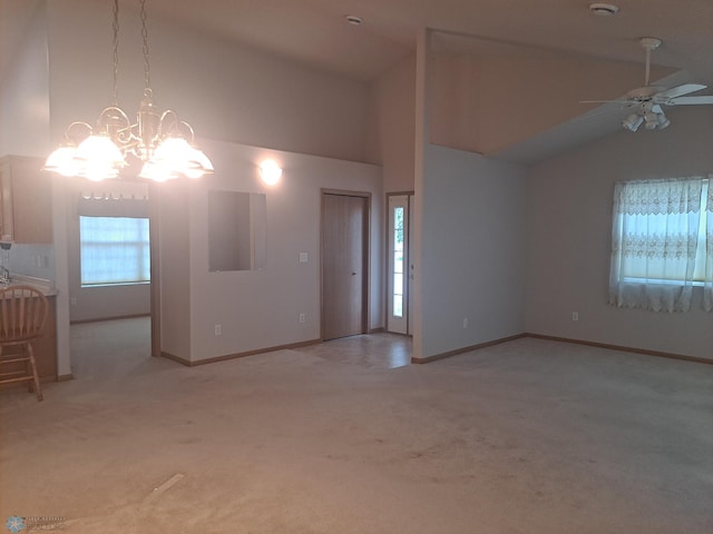 5409 University Dr S Unit D, Fargo, ND 58104 - unfurnished living room featuring light carpet, a chandelier, ceiling fan, and high vaulted ceiling