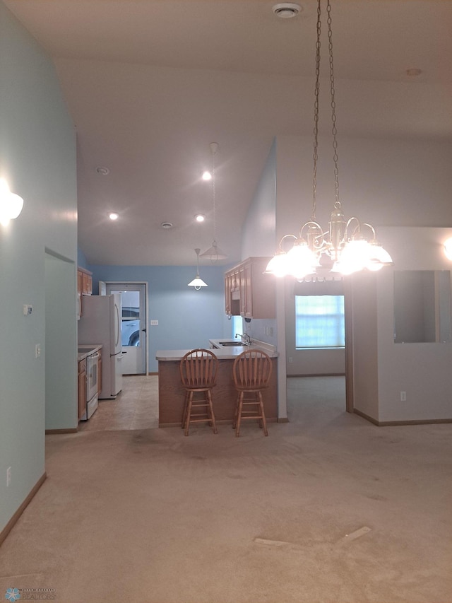 5409 University Dr S Unit D, Fargo, ND 58104 - dining space featuring light carpet, a chandelier, and high vaulted ceiling