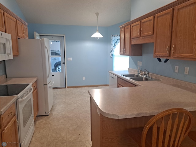 5409 University Dr S Unit D, Fargo, ND 58104 - kitchen featuring white appliances, brown cabinetry, washer / clothes dryer, and light countertops