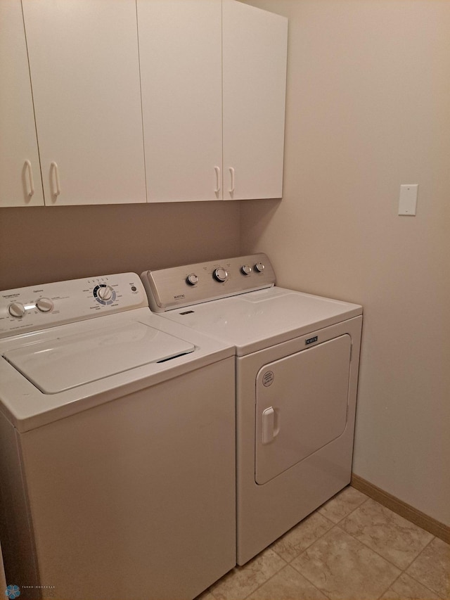 5409 University Dr S Unit D, Fargo, ND 58104 - laundry area with separate washer and dryer, cabinet space, and light tile patterned floors
