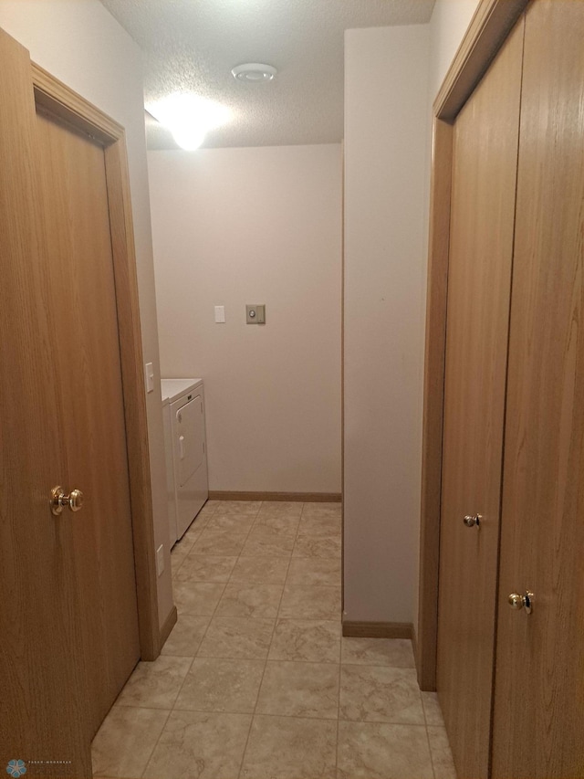 5409 University Dr S Unit D, Fargo, ND 58104 - corridor featuring independent washer and dryer and a textured ceiling