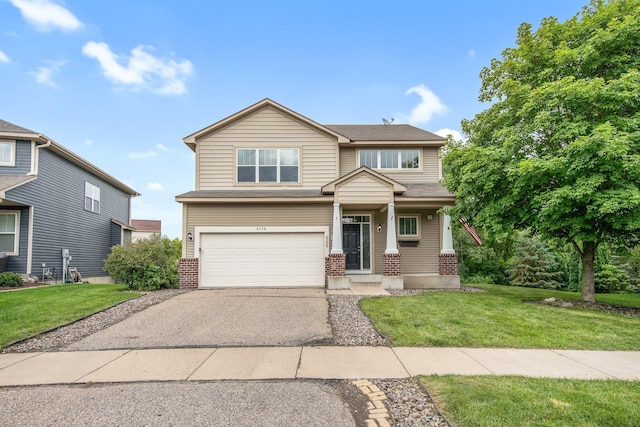 6758 Troy Ln N, Maple Grove, MN 55311 - view of front of home with brick siding, an attached garage, asphalt driveway, and a front yard