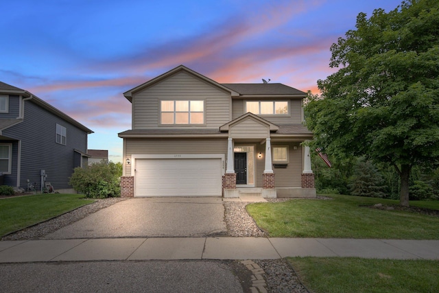 6758 Troy Ln N, Maple Grove, MN 55311 - view of front of house featuring brick siding, an attached garage, asphalt driveway, and a front lawn