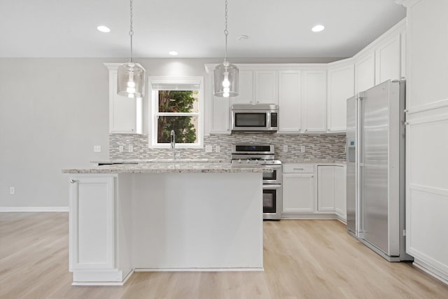 6758 Troy Ln N, Maple Grove, MN 55311 - kitchen with stainless steel appliances, backsplash, light wood finished floors, white cabinetry, and recessed lighting