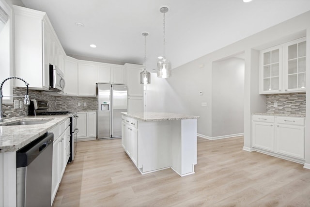 6758 Troy Ln N, Maple Grove, MN 55311 - kitchen featuring appliances with stainless steel finishes, backsplash, a kitchen island, white cabinetry, and recessed lighting