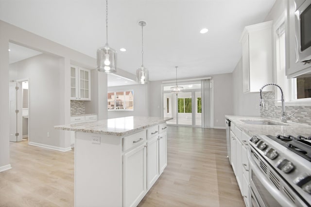 6758 Troy Ln N, Maple Grove, MN 55311 - kitchen featuring backsplash, a center island, recessed lighting, and white cabinets
