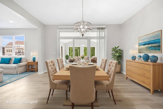 6758 Troy Ln N, Maple Grove, MN 55311 - dining area with a chandelier and light wood finished floors