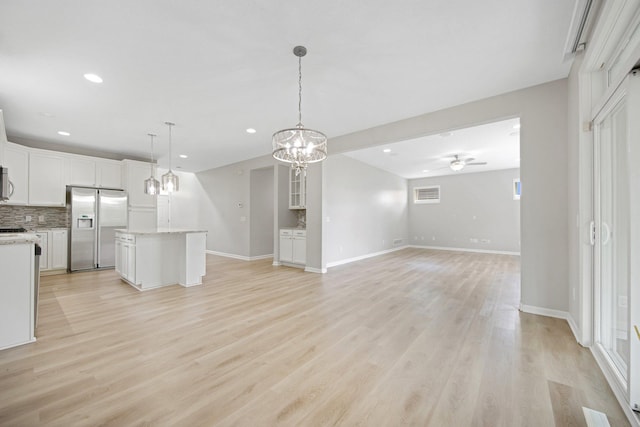 6758 Troy Ln N, Maple Grove, MN 55311 - kitchen featuring stainless steel fridge, a ceiling fan, decorative backsplash, recessed lighting, and white cabinets
