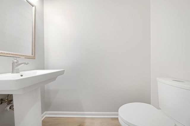 6758 Troy Ln N, Maple Grove, MN 55311 - half bathroom with toilet and baseboards