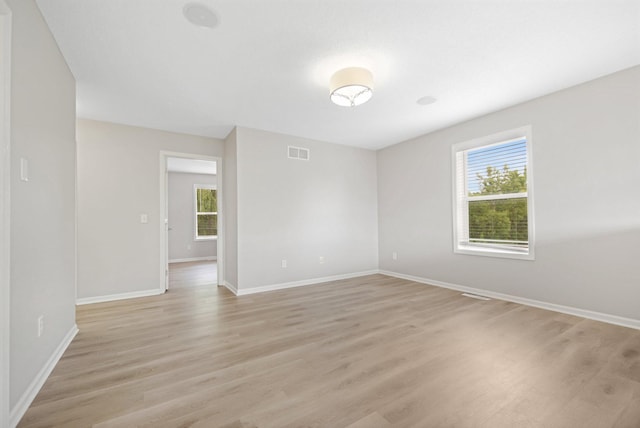 6758 Troy Ln N, Maple Grove, MN 55311 - unfurnished room with healthy amount of natural light and light wood-style flooring