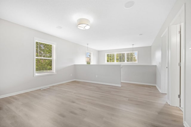 6758 Troy Ln N, Maple Grove, MN 55311 - spare room with light wood finished floors and baseboards