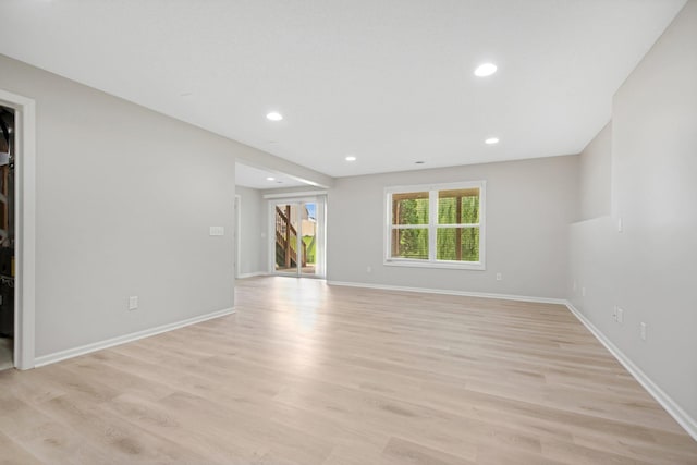 6758 Troy Ln N, Maple Grove, MN 55311 - unfurnished living room featuring light wood-type flooring and recessed lighting