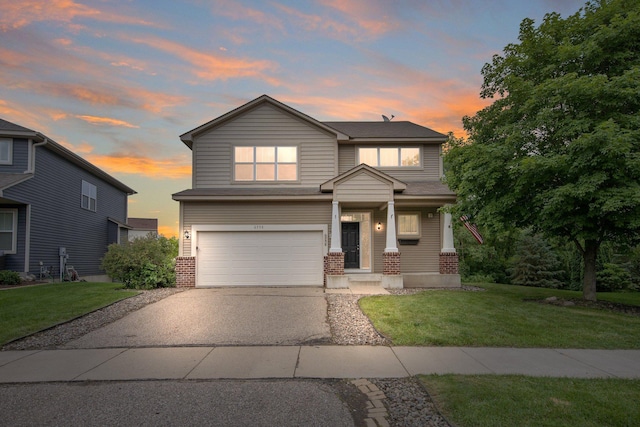 6758 Troy Ln N, Maple Grove, MN 55311 - view of front of property featuring brick siding, a garage, asphalt driveway, and a front yard