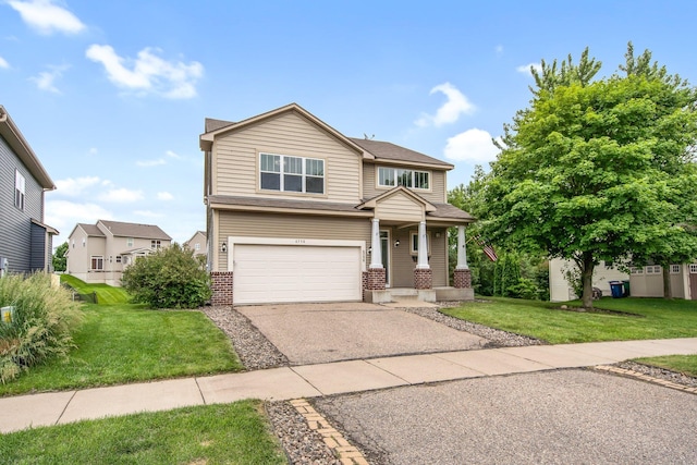 6758 Troy Ln N, Maple Grove, MN 55311 - view of front of property featuring a garage, brick siding, a front yard, driveway, and covered porch