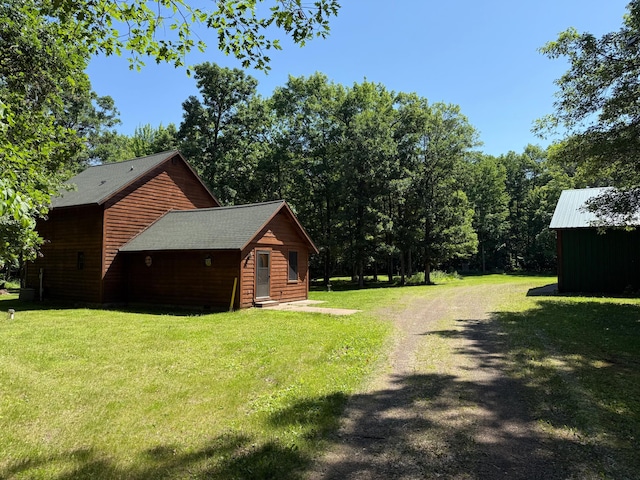43564 Tamarack River Rd, Ogema Twp, MN 55037 - view of property exterior featuring a yard and driveway