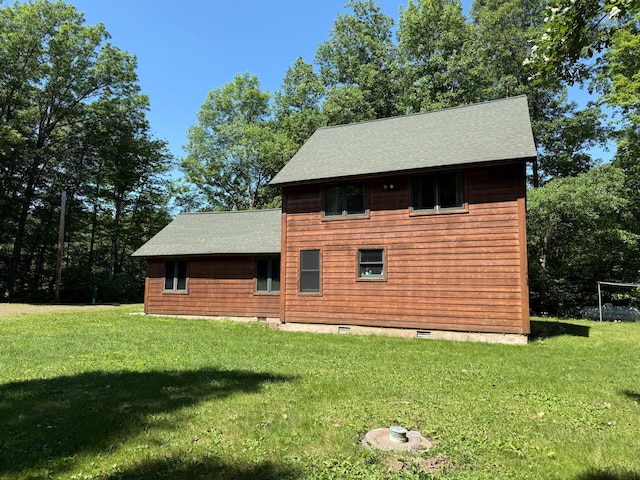 43564 Tamarack River Rd, Ogema Twp, MN 55037 - view of property exterior featuring a yard, roof with shingles, and crawl space