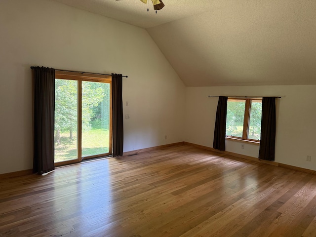 43564 Tamarack River Rd, Ogema Twp, MN 55037 - empty room featuring ceiling fan, vaulted ceiling, and wood finished floors