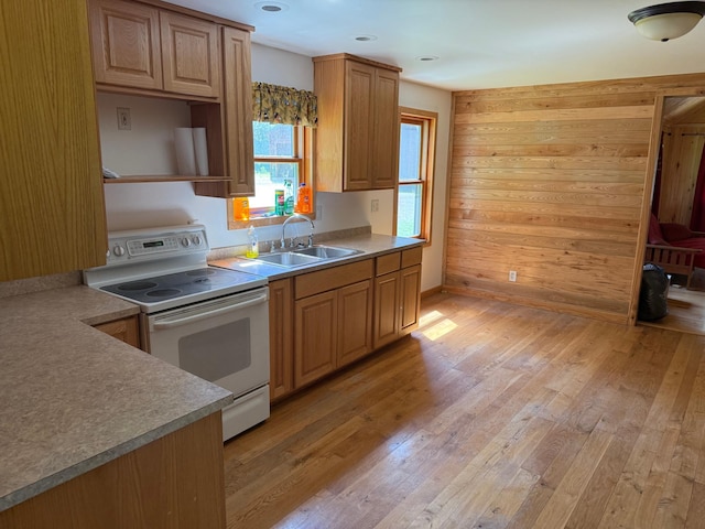 43564 Tamarack River Rd, Ogema Twp, MN 55037 - kitchen with white electric range oven, light wood-style floors, open shelves, wood walls, and light countertops