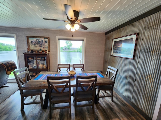 207 Mill Rd, Park Rapids, MN 56470 - dining space with wood finished floors, a ceiling fan, brick wall, and wooden ceiling