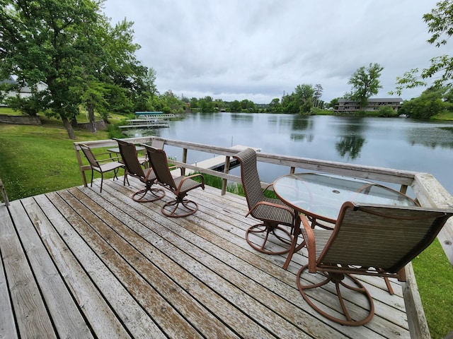 207 Mill Rd, Park Rapids, MN 56470 - wooden terrace with a water view and a lawn