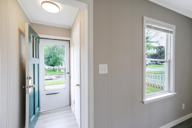 913 12th Ave SE, Austin, MN 55912 - doorway to outside featuring healthy amount of natural light and light wood-type flooring