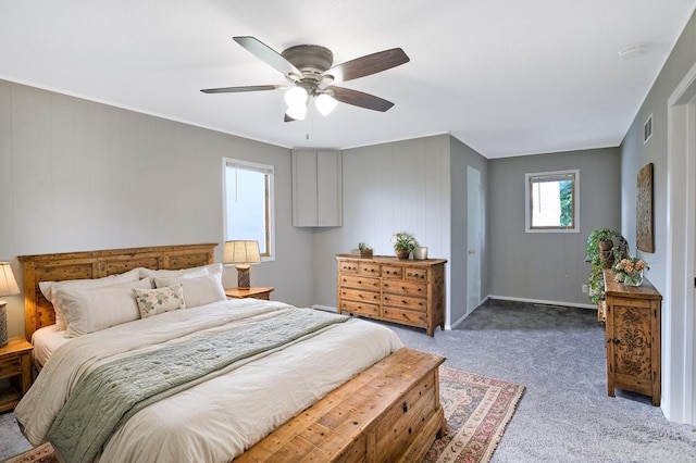 913 12th Ave SE, Austin, MN 55912 - bedroom featuring light carpet and a ceiling fan