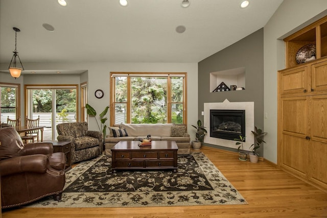 485 Preserve Path W, Saint Paul, MN 55118 - living area with wood finished floors, plenty of natural light, a glass covered fireplace, lofted ceiling, and recessed lighting
