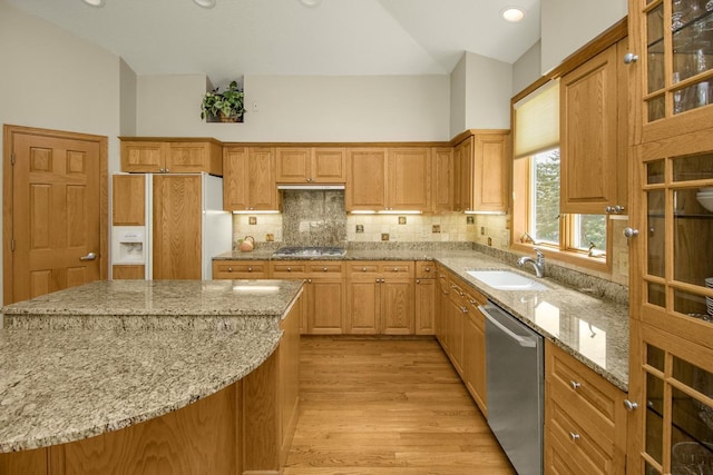 485 Preserve Path W, Saint Paul, MN 55118 - kitchen featuring appliances with stainless steel finishes, light wood-type flooring, light stone countertops, backsplash, and glass insert cabinets