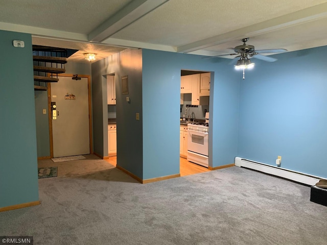 7236 72nd Ln N Unit 202, Brooklyn Park, MN 55428 - unfurnished room with baseboard heating, beamed ceiling, ceiling fan, and light carpet