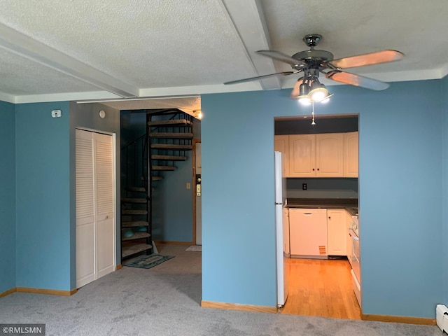 7236 72nd Ln N Unit 202, Brooklyn Park, MN 55428 - kitchen featuring white dishwasher, ceiling fan, dark countertops, a textured ceiling, and a baseboard heating unit