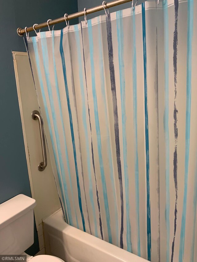 7236 72nd Ln N Unit 202, Brooklyn Park, MN 55428 - bathroom with shower / bath combo and toilet
