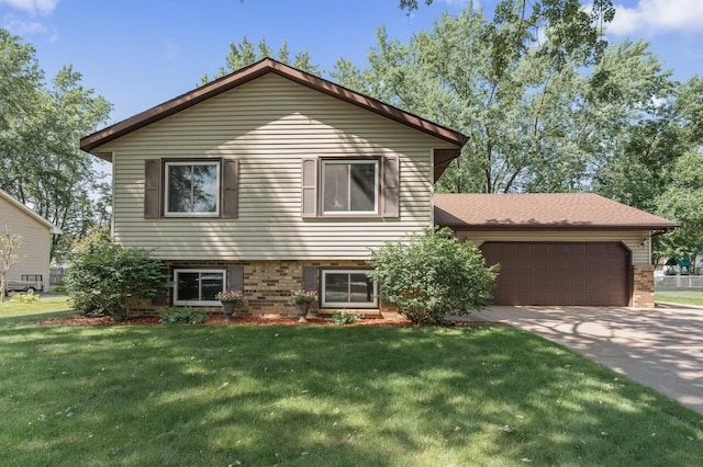 4133 88th Ave NE, Blaine, MN 55014 - tri-level home with brick siding, concrete driveway, a garage, and a front lawn