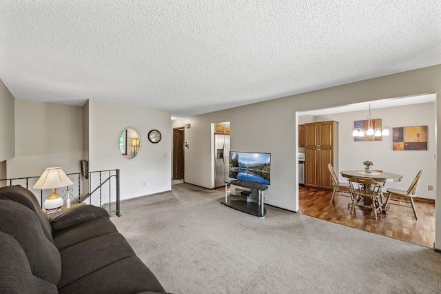 4133 88th Ave NE, Blaine, MN 55014 - living area with a chandelier, light carpet, and a textured ceiling