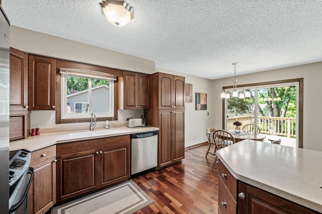 4133 88th Ave NE, Blaine, MN 55014 - kitchen with stainless steel dishwasher, stove, a chandelier, dark wood-style floors, and light countertops