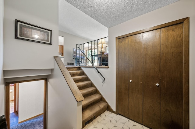 4133 88th Ave NE, Blaine, MN 55014 - stairs featuring a textured ceiling