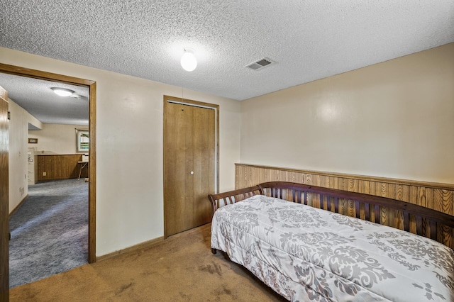 4133 88th Ave NE, Blaine, MN 55014 - carpeted bedroom featuring a closet and a textured ceiling